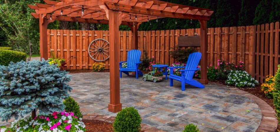 Wooden,pergola,on,pavers,landscape,design,with,select,ornamental,flowers