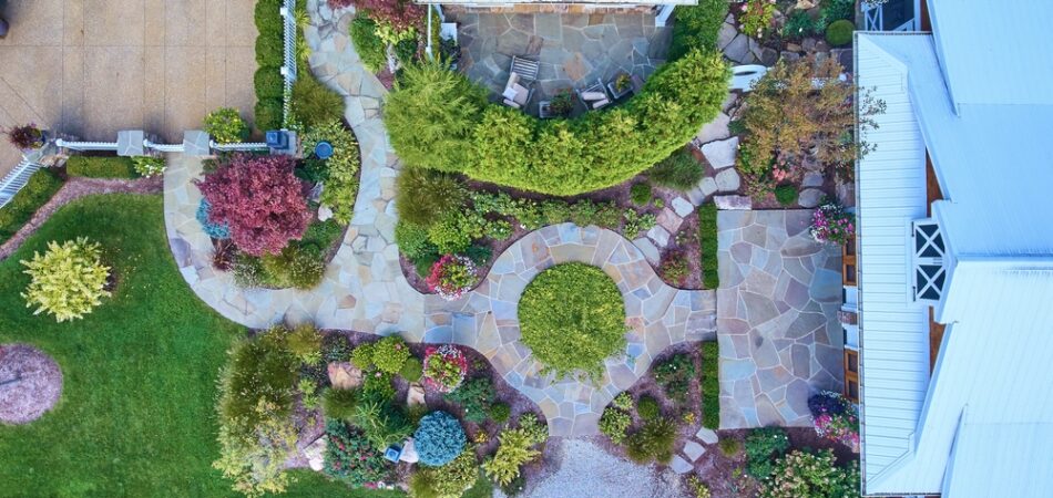 Aerial,view,of,lush,residential,garden,with,stone,patio,and